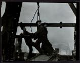 [Men working on Empire State Building]