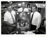 Jim Albright, Hunter Low, and John Barr holding plaque for 1987 Kodak Women's All America Basketball team