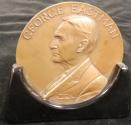 Bronze medallion presented to Myron J. Dibley in Recognition of 25 Years at Eastman Kodak Company