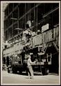 [Unloading truck with derrick, Empire State building]