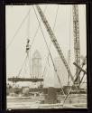[Derrick at work, Empire State building construction]