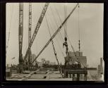 [Derricks, Empire State building construction]