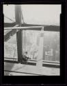 [Man with cutting torch on girders, Empire State Building]