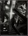 [Man using cutting torch on girders, Empire State Building]