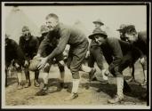 [Soldiers playing football, Army training camp]