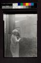 [Bricklayer at work]