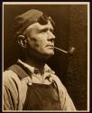 [Worker with goggles and a pipe, Empire State Building]