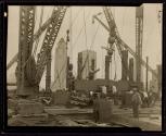 [Derricks, Empire State building construction]