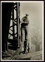 [Man with cutting torch on girders, Empire State Building]
