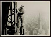 [Man with cutting torch on girders, Empire State Building]