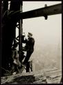 [Men with cutting torch on girders, Empire State Building]