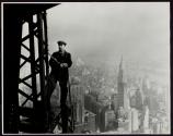 [Man with cutting torch on girders, Empire State Building]