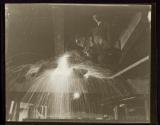 [Man using cutting torch, Empire State Building]