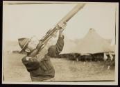 [Soldier aiming automatic rifle, Army training camp]