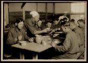 [Soldiers in mess hall, Army training camp]