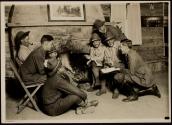 [Soldiers by fireplace, Army training camp]