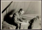 [Soldier writing letter, Army training camp]