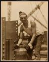 [Worker with bucket, Empire State Building]