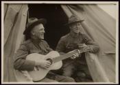 [Soldiers with guitars, Army training camp]