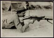[Soldier with automatic rifle, Army training camp]