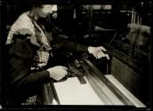 [Textile worker at loom]
