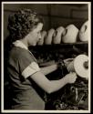 Hand operated knot-tyer used on a winding machine. North Carolina textile mill.