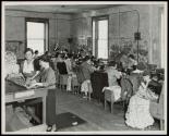[Corner of a dress shop making house dresses wholesale. The poor light and working conditions may be noted.]
