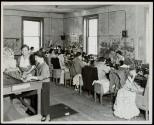 Corner of a dress shop making house dresses wholesale. The poor light and working conditions may be noted. Photo made in a N.J. Factory Town.