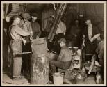 [Men at work in glass factory]