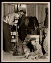 The old hand method of blowing glass bottles, that has changed but little since the days of the Egyptians, - still requires highly skilled workers.