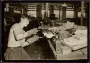 [Semi-skilled worker moulding rubber dolls in a Mass. factory]