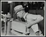 [Shaper, drawer fronts, shaping, machine and man in operation]
