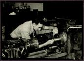 [Man at machine]