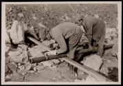 William L. Carden, of Anderson County, Tennessee, acetylene burner, cutting pipe at Norris Dam site. The helper is C.L. Hatmaker, of Campbell County.
