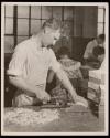 Gaines McGlothin, R.F.D. #2, Kingsport, Tennessee. McGlothin is here shown cutting index tabs in the process of indexing a book. This is a medium-skilled operation, requiring accuracy and care. ...
