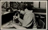 Ruby Hilton, Lynn Gardens, Kingsport, Tennessee. Another view of the superfinish operation calling for the spraying of gold with an air gun. This girl has worked two to three years at the Kingsport Press.