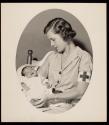 [Red Cross worker with baby, Watkins Glen]
