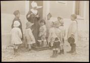 [Nun weighing children, ARC War Relief]