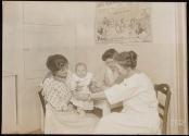 [Red Cross nurse with mother & child, ARC War Relief]