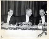 Men at hotel dining table