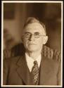 [Man wearing glasses]
