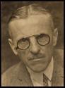 [Man wearing glasses]