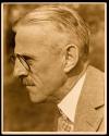 [Man wearing glasses in profile]