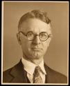 [Man wearing glasses]