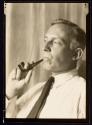 [Man smoking pipe]