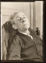 [Lewis Wickes Hine, seated in chair with head back]