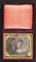 [Man and weeping woman with deceased child]