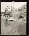 [Men on dock by lagoon ride - World's Fair (?)]