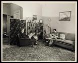 [People reading in living room]