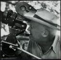 Checking camera shot for film, Avery Island, Louisiana
